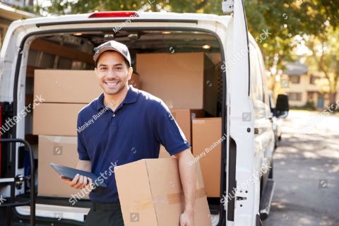 stock-photo-portrait-of-courier-with-digital-tablet-delivering-package-794998891